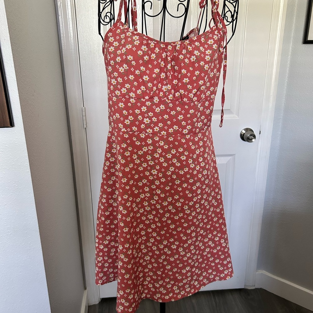 Vibrant Red Mini Dress with Floral Pattern and Sleeveless Design